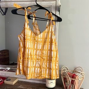 Women’s yellow plaid tank top.
